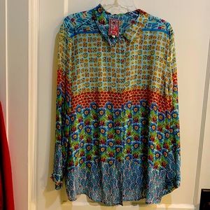 Bought this for a party, cut tags off never wore. It is a beautiful casual top: